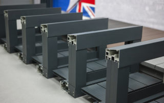 AliDeck factory crew manufacture lovely desktop-sized AliRail with Glass Infill Balustrade Balcony Samples