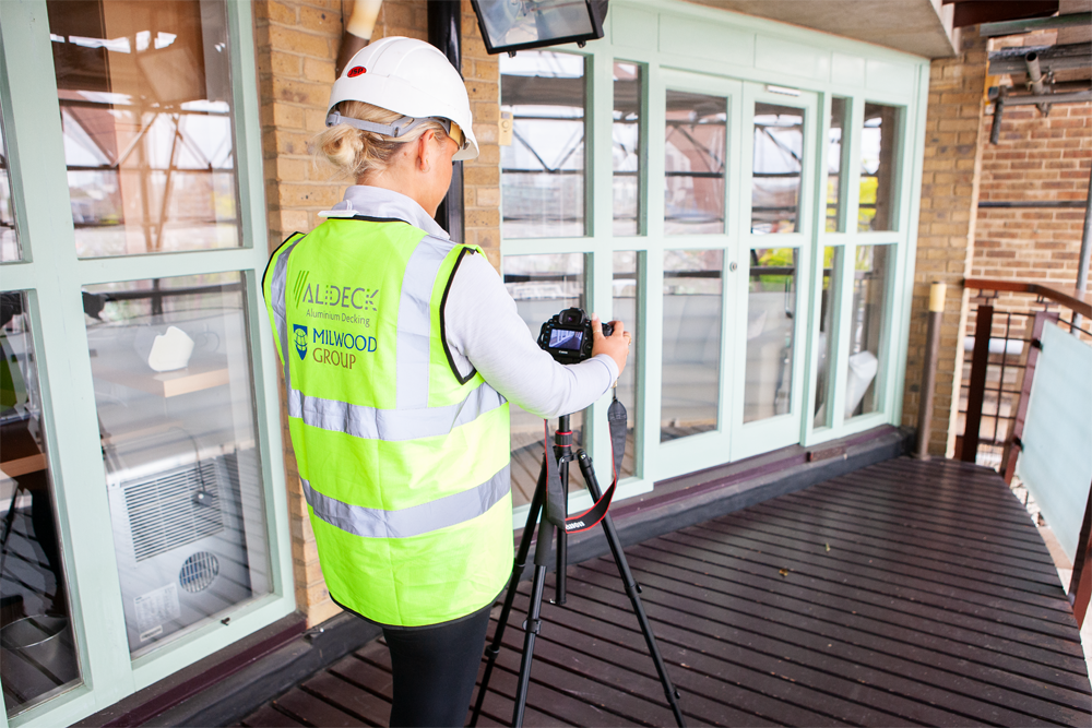 AliDeck marketing assistants make site visit to decking replacement project near Tower Bridge, London, to capture photographs and video of work completed by our Approved Installer