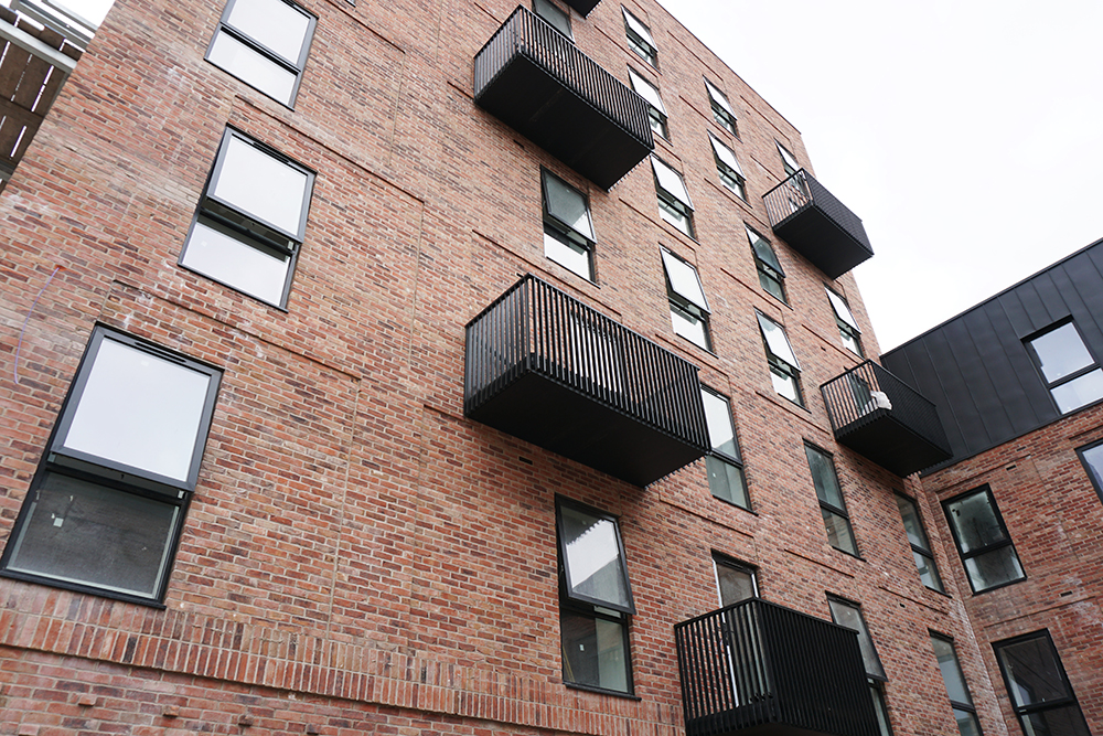 AliDeck make site visit to see work-in-progress on installation of our modular balcony kit of decking, soffit cladding and balustrade to steel balconies