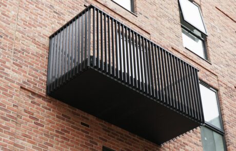 AliDeck Modular Balcony Kit, comprising non-combustible aluminium decking, soffit cladding and balustrades