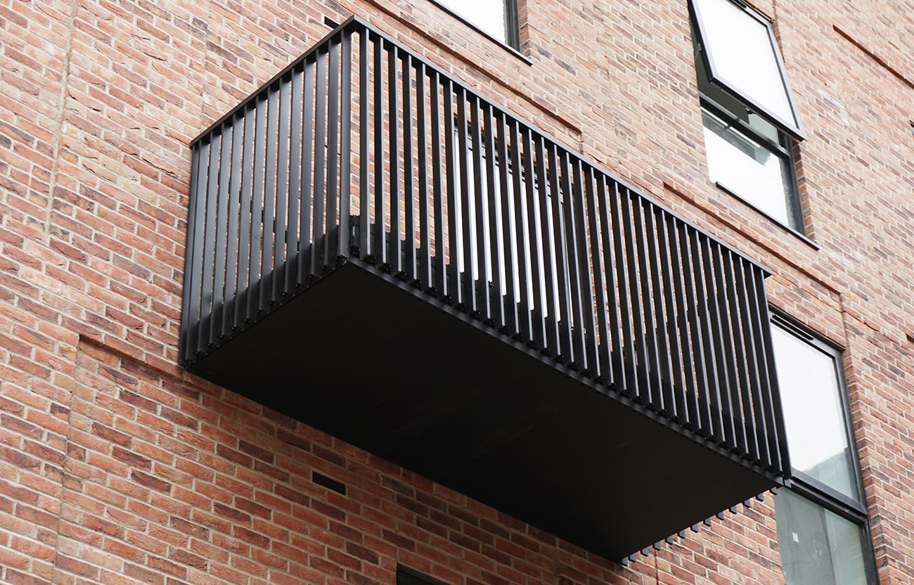 AliDeck Modular Balcony Kit, comprising non-combustible aluminium decking, soffit cladding and balustrades
