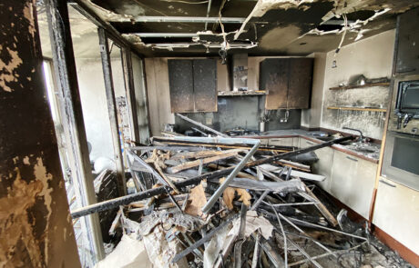 Gutted interior of a flat from a fire started on a balcony by a carelessly discarded cigarette